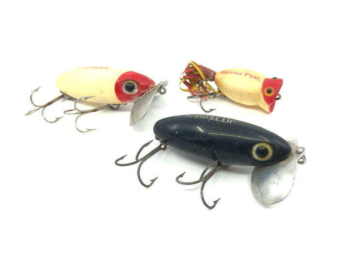 Two Arbogast Jitterbugs and One Hula Popper