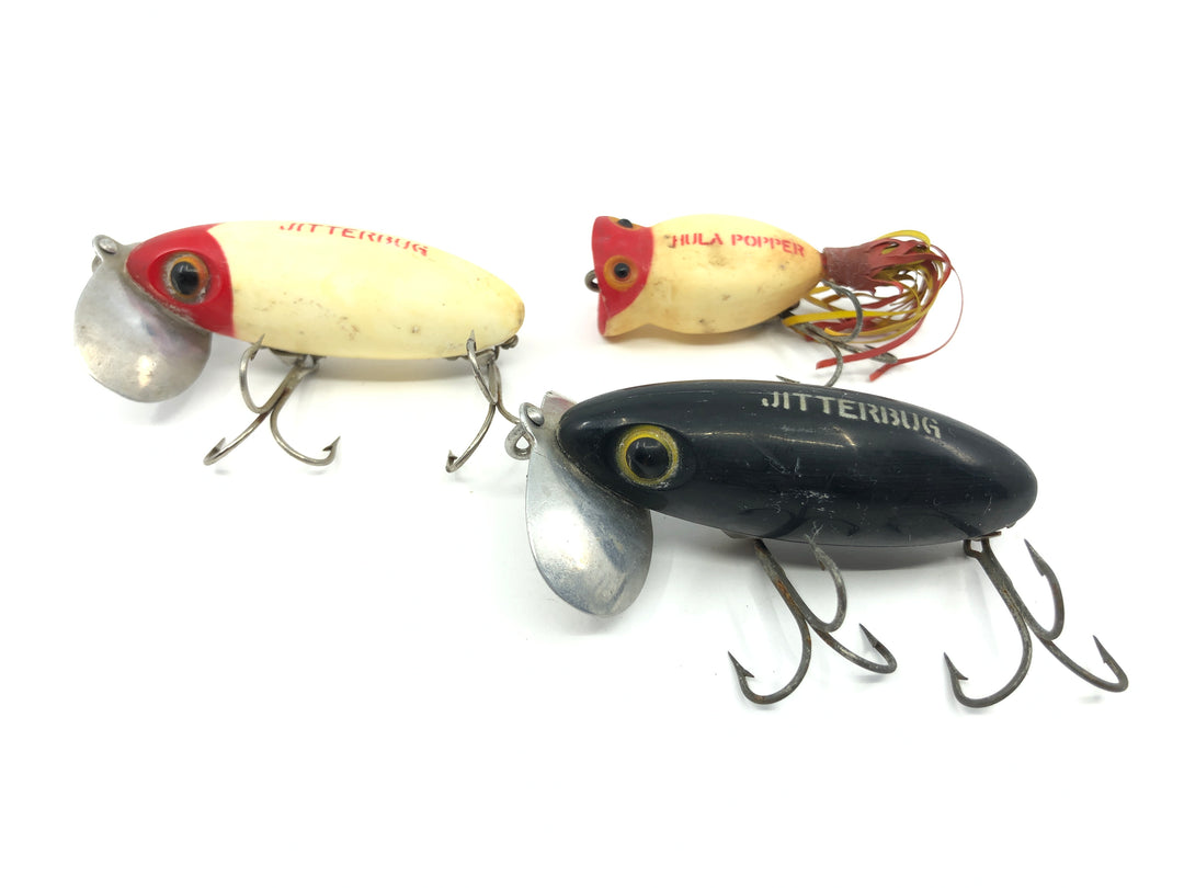 Two Arbogast Jitterbugs and One Hula Popper