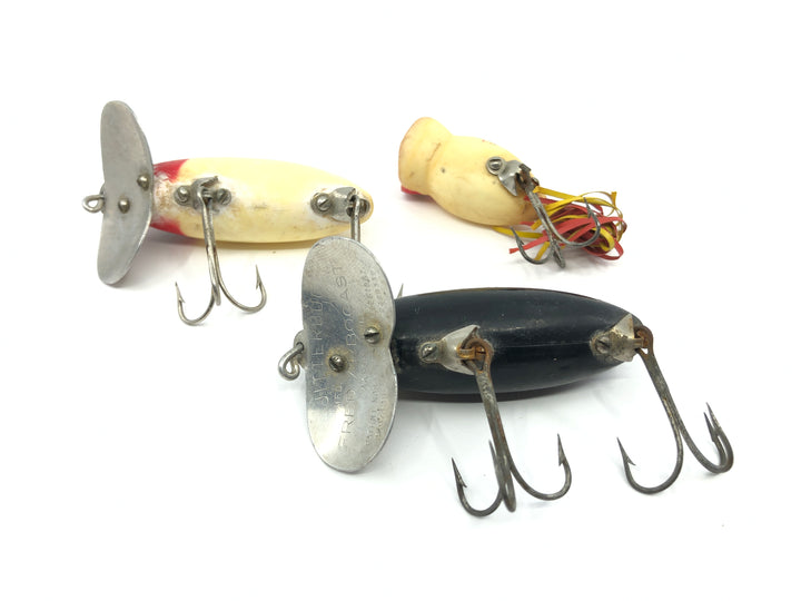 Two Arbogast Jitterbugs and One Hula Popper